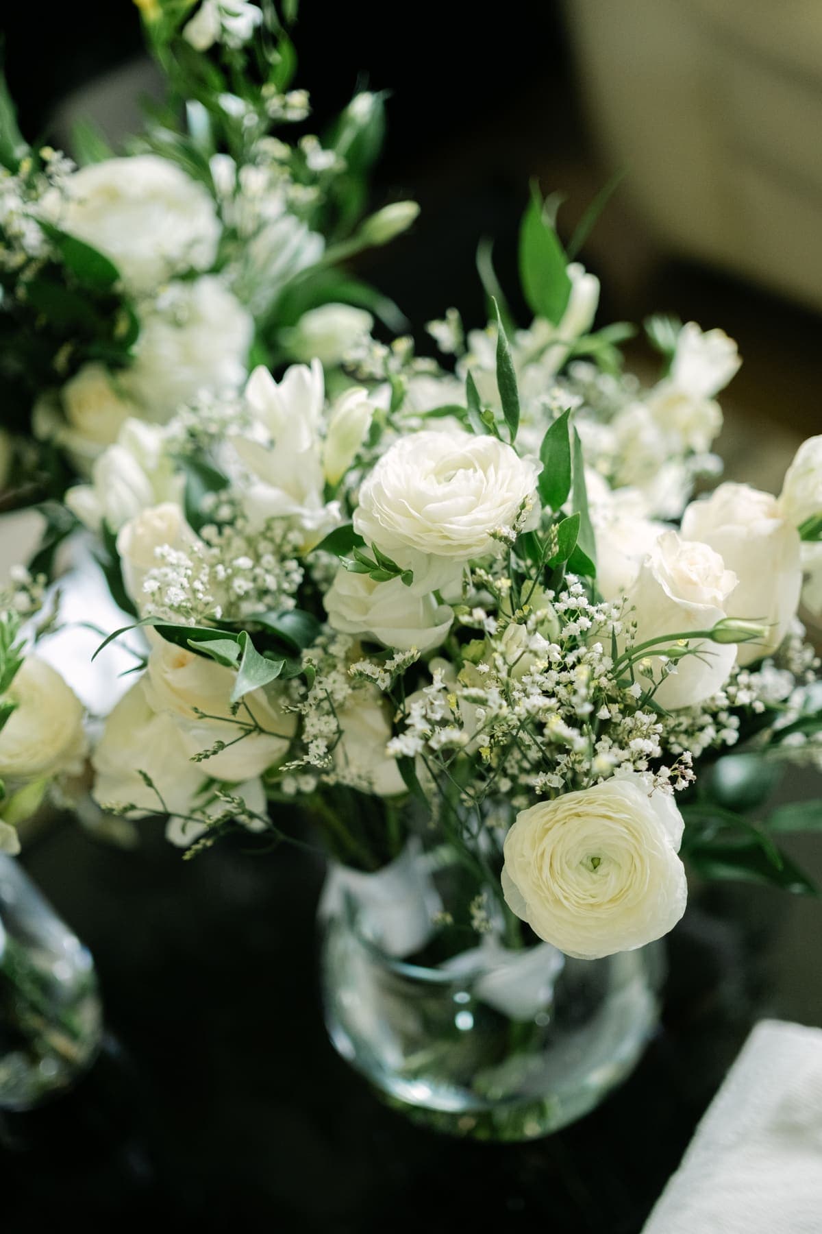 Fresh white floral arrangements in glass vases