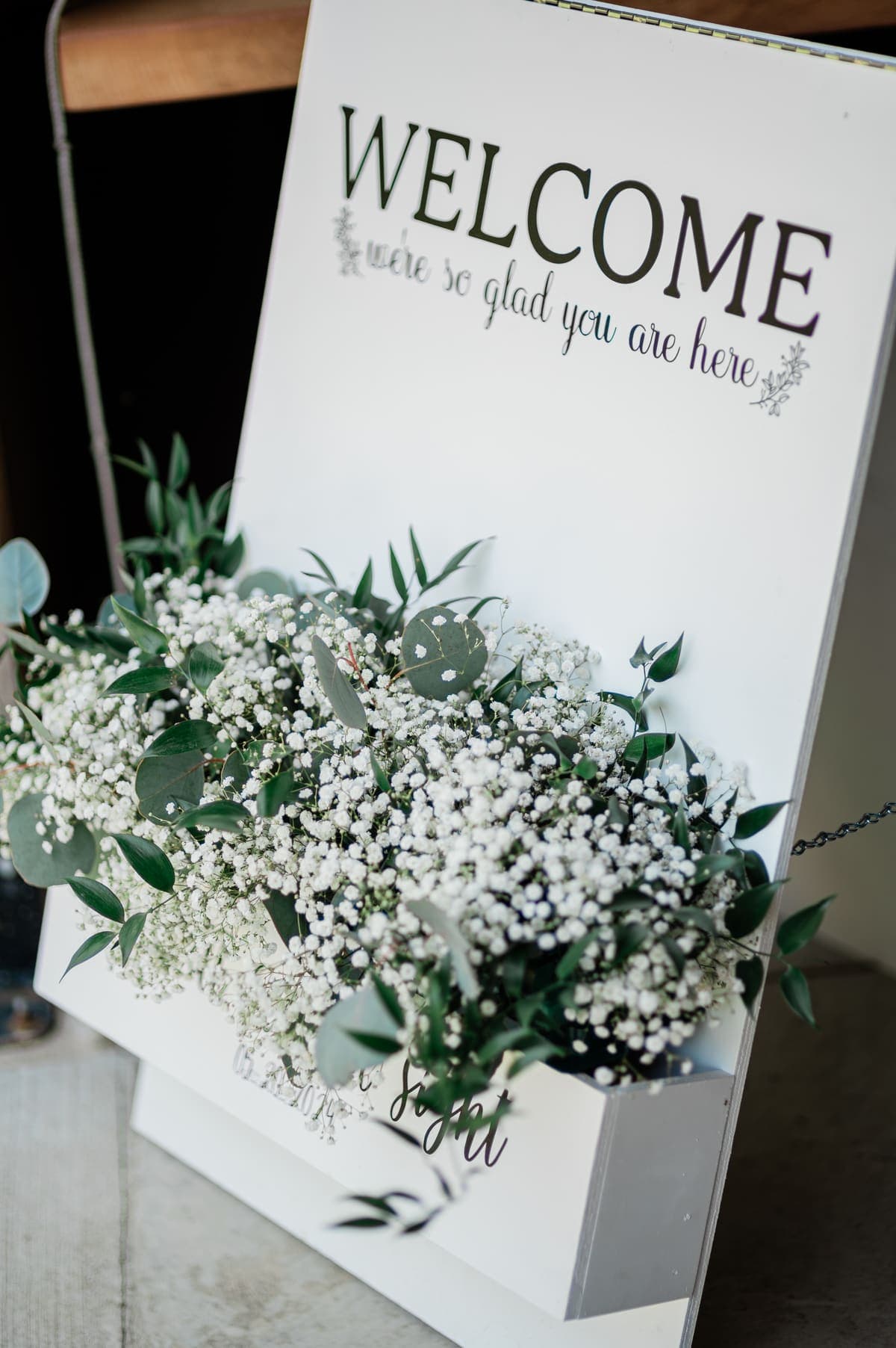 Welcome sign decorated with baby's breath